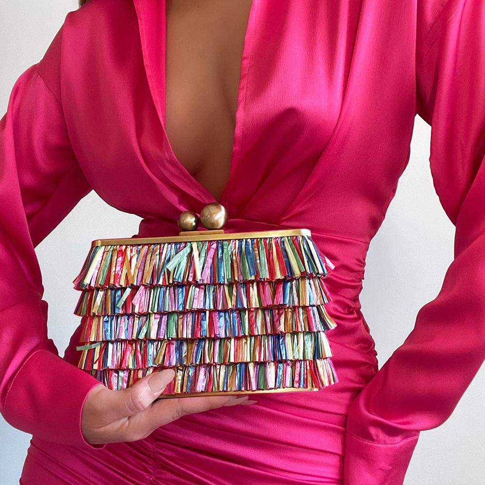 Woman in Hot Pink Silk Dress Holding CARLITA Carnivale Fringed Clutch Multi Color Zoom View - Olga Berg